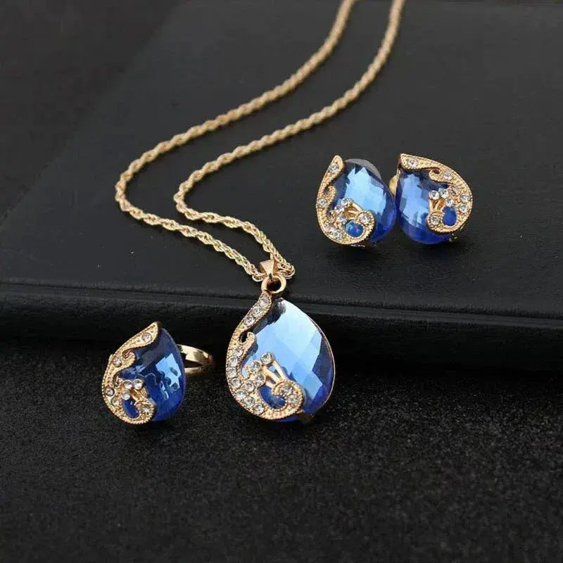Blue Crystal Necklace + Earring Set in Blue Crystal in Gold Unique Joyas