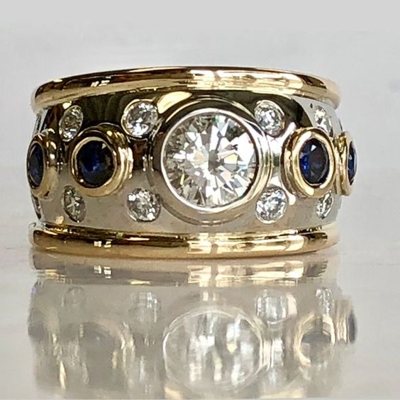 Noble gold ring with zirconia and blue crystals