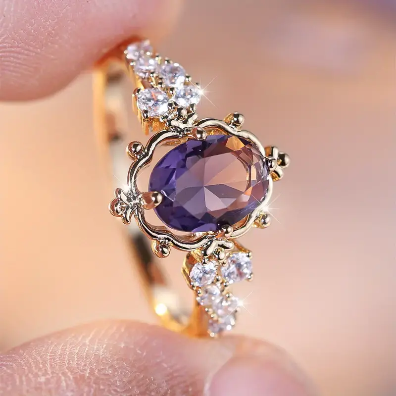 Elegant gold ring with violet stone and fine crystals